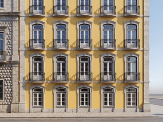 Fototapeta premium Yellow building facade with arched windows and wrought iron balconies