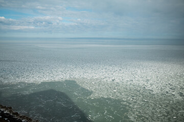 Frozen Sea and Ice Floes Under a Cloudy Winter Sky on the Distant Horizon © FullFrames