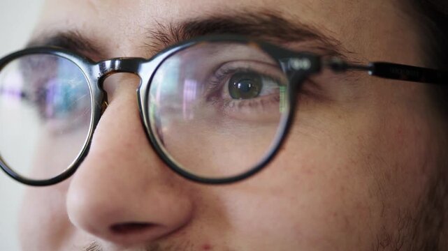 Man, glasses and closeup at office with reflection for review with insight, decision and career at company. Person, spectacles and prescription eyewear for vision, feedback or optometry at agency