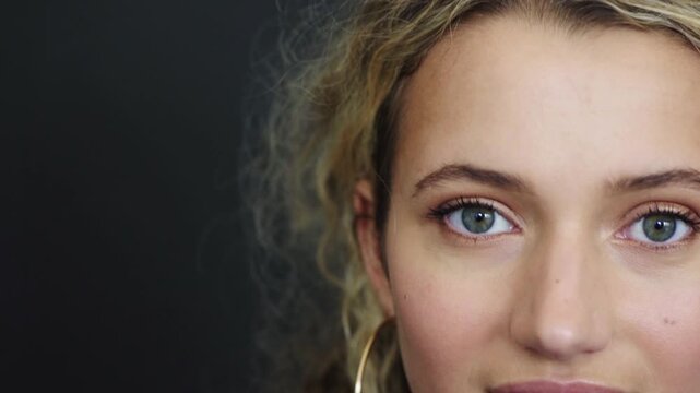 Optometry, space and face of woman in studio with contact lenses for prescription for eyesight. Eye care, optical health and portrait of person by gray background with vision, test or ophthalmology.