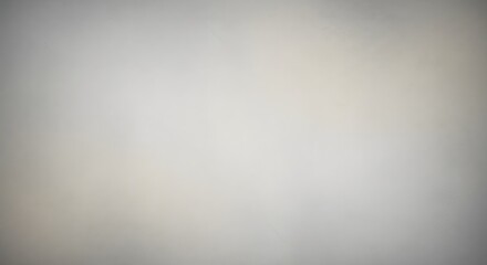 A minimalist and clean neutral gray wall texture featuring subtle gradients and soft light diffusion