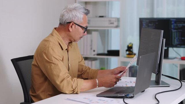 Tired programmer suffering stress and burnout while working at office on software development task