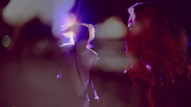 Female singer stepping lights shifting raising mic singing music male backing bokeh revealing faces