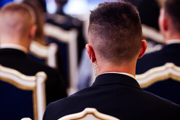 Protection and Guard Service (SPP, Romanian version of the US Secret Service) officer in public during the speech of a dignitary