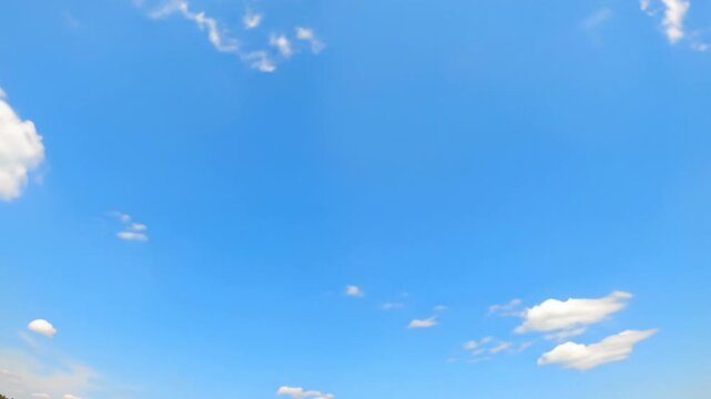 A very slow, smooth video, low-angle, ultra-wide light blue sky with soft white cumulus clouds, ample copy space for text, clean bright natural daylight, serene and optimistic future concept