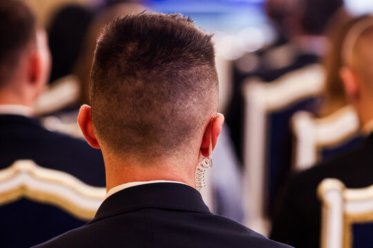 Protection and Guard Service (SPP, Romanian version of the US Secret Service) officer in public during the speech of a dignitary