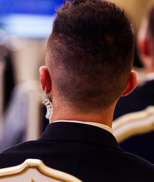 Protection and Guard Service (SPP, Romanian version of the US Secret Service) officer in public during the speech of a dignitary