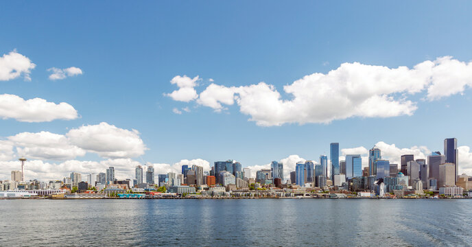 Bright and sunny panoramic view of Seattle skyline from the water
