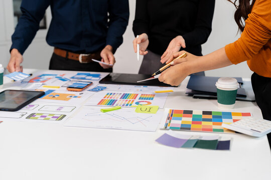 UX developer and ui designer brainstorming about mobile app interface wireframe design with customer breif and color code, User experience concept.