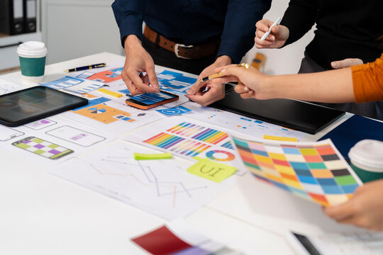 UX developer and ui designer brainstorming about mobile app interface wireframe design with customer breif and color code, User experience concept.
