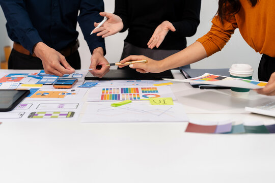 UX developer and ui designer brainstorming about mobile app interface wireframe design with customer breif and color code, User experience concept.
