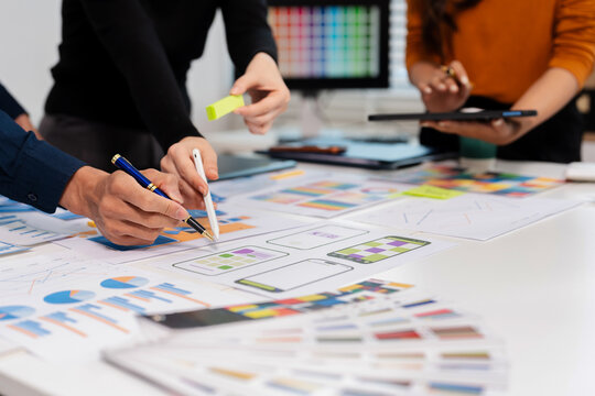UX developer and ui designer brainstorming about mobile app interface wireframe design with customer breif and color code, User experience concept.