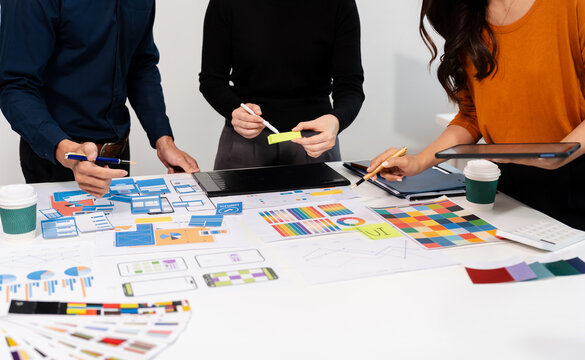UX developer and ui designer brainstorming about mobile app interface wireframe design with customer breif and color code, User experience concept.