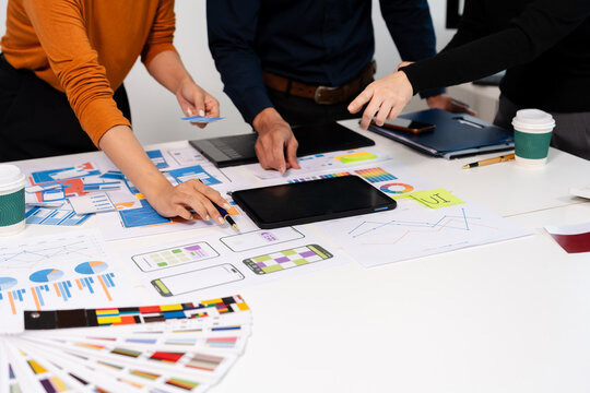 UX developer and ui designer brainstorming about mobile app interface wireframe design with customer breif and color code, User experience concept.