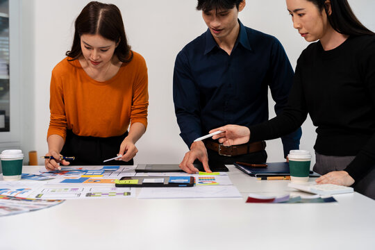UX developer and ui designer brainstorming about mobile app interface wireframe design with customer breif and color code, User experience concept.