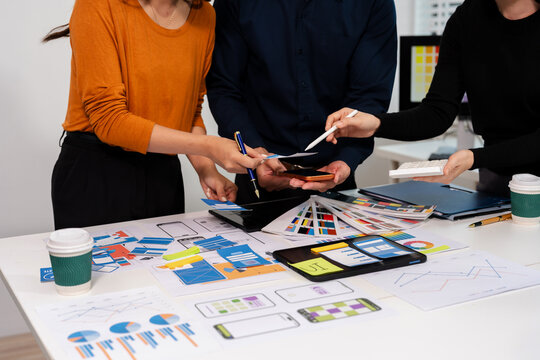 UX developer and ui designer brainstorming about mobile app interface wireframe design with customer breif and color code, User experience concept.