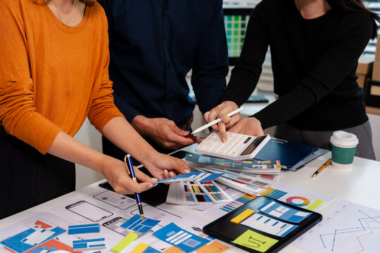 UX developer and ui designer brainstorming about mobile app interface wireframe design with customer breif and color code, User experience concept.