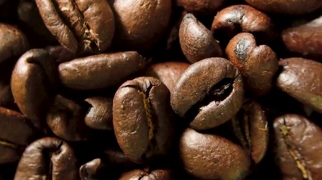 Top view of roasted coffee beans rotating slowly