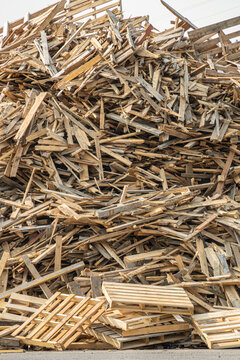 Pile of used wooden pallets to recycle