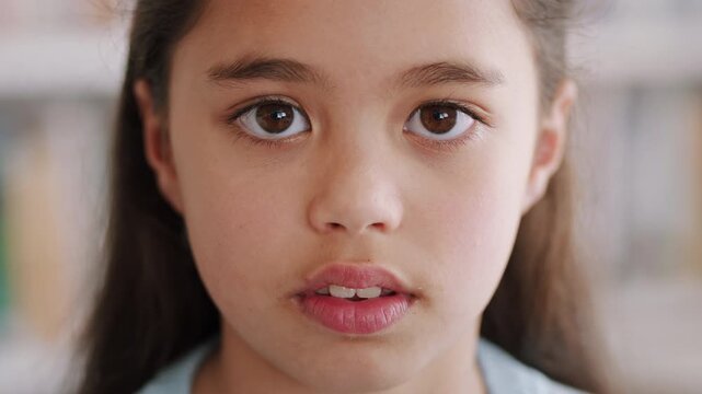 Face, future and learning with girl in classroom for child development, knowledge or study. Academics, class and education with student kid in elementary school for curriculum, growth or syllabus