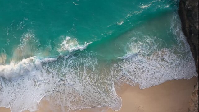 Sunny tropical beach with ocean waves from above, summer vibes aerial footage.