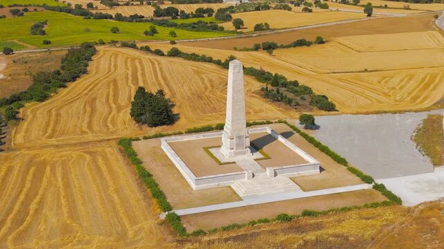 Seddulbahir, Eceabat, Turkey. Close-up aerial view of Helles Memorial obelisk honoring WWI soldiers at Gallipoli. Dardanelles Strait and Aegean Sea background. Clear day. Aerial View, MasterShots, Ci