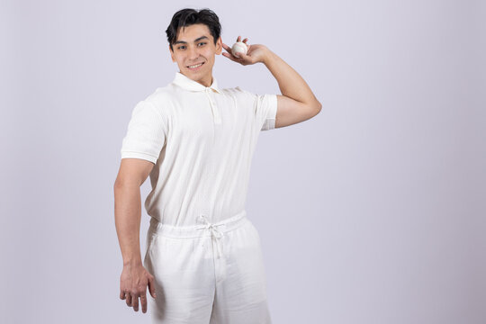 Man flexing his bicep on a white background in studio
