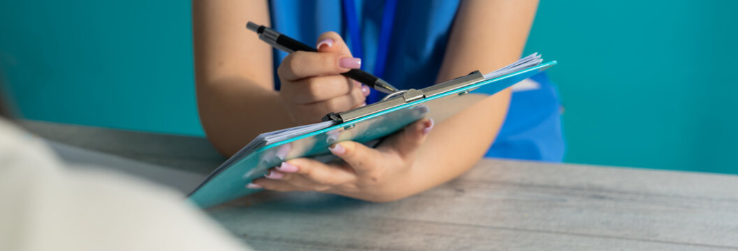 Doctor Prescribing Medication to a Patient
