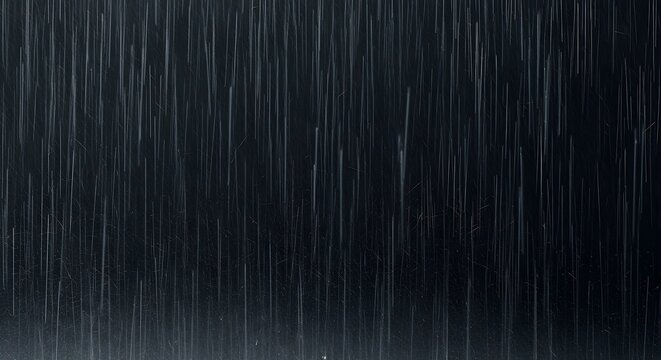 Intense downpour with heavy vertical rain streaks against a dark, atmospheric backdrop