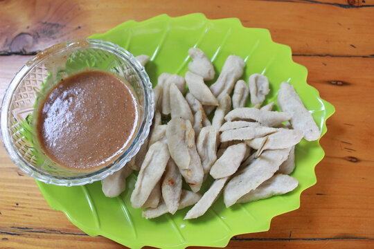 a plate of otak ota with nut sauce