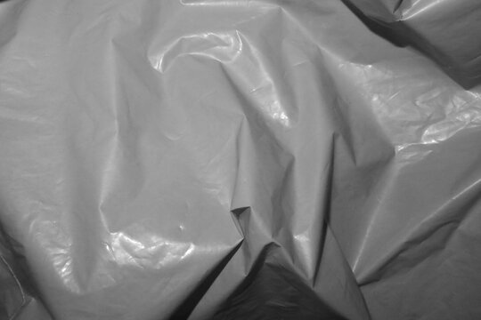 Crumpled grey plastic texture background.