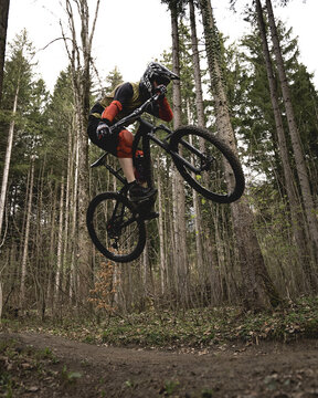 Mountain biker jumping high in the air