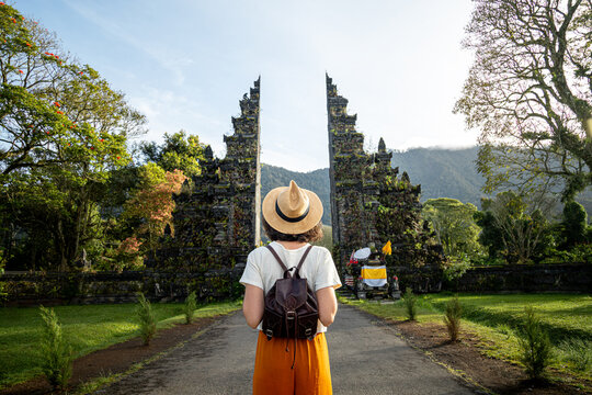 Traveler finding spiritual path at handara gate, bali