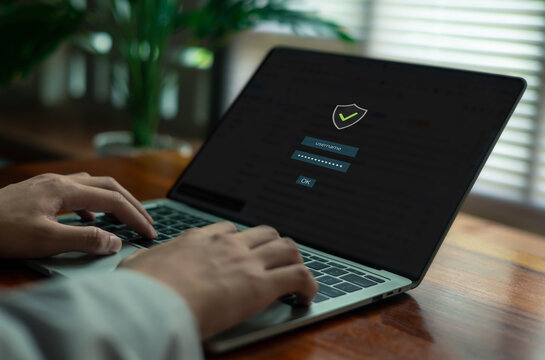user entering a secure password on a laptop login screen, representing cybersecurity, data protection, user authentication, privacy, and safe digital access in a modern technology environment.