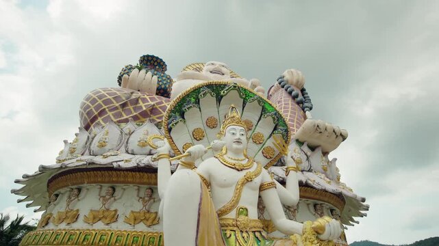 Guanyin statue with naga serpent and Big Buddha at Wat Plai Laem temple on Koh Samui in Thailand
