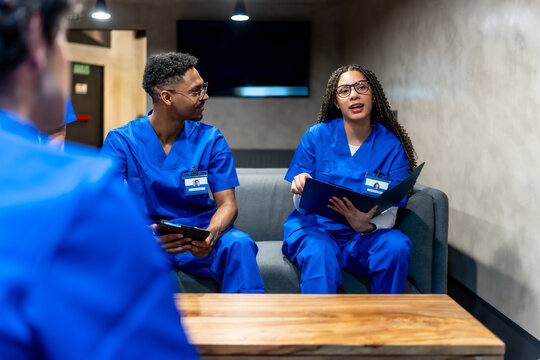 Healthcare professionals discussing patient information during a break