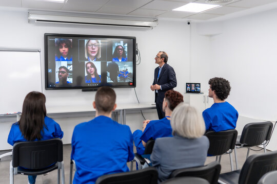 Medical students attending healthcare training during online video conference