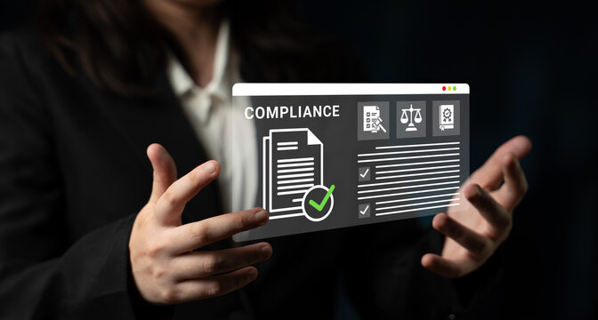 A business professional showcases a digital compliance document featuring checkmarks and legal symbols, symbolizing adherence to regulations and standards in the workplace. Ledger