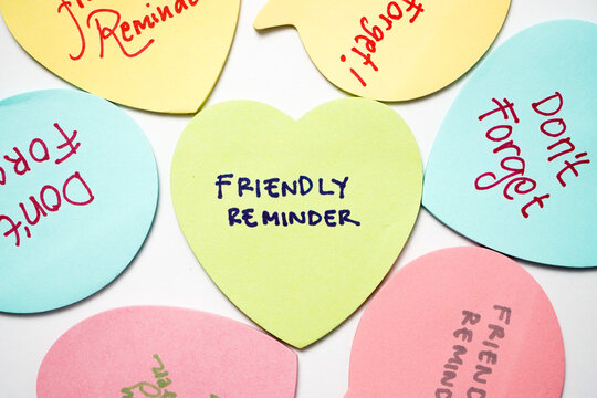 Text friendly reminder colorful sticky notes paper. Business concept