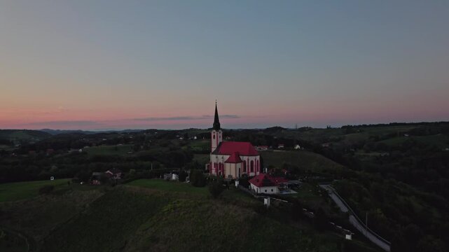Gorca - Marijina cerkev v Malečniku - magical church near Maribor, Slovenia during sunset, Drone footage