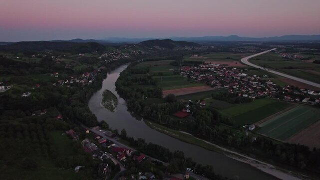 Drone view on the river Drava near Malečnik and Maribor during sunset
