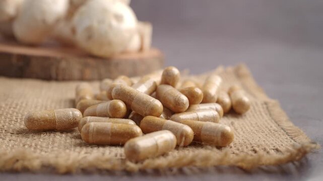 Natural health supplements on a table with mushrooms