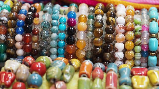 Colorful beads on display at market in daylight hours