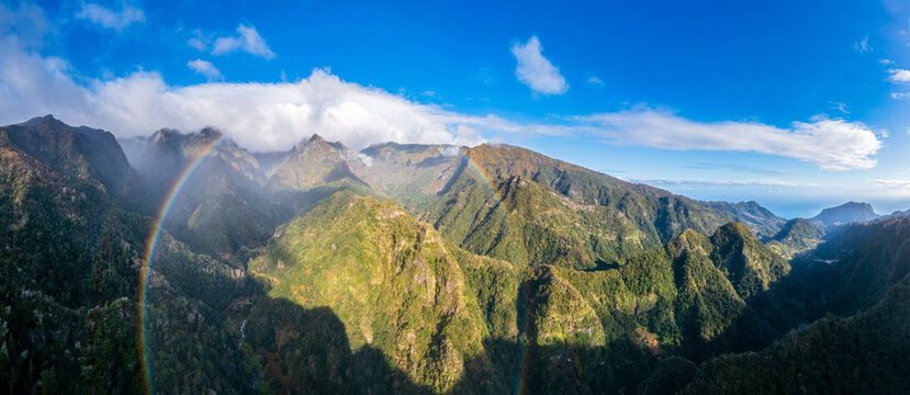 Rainbow over Madeira's Miradouro dos Balc�es mountains from aerial view