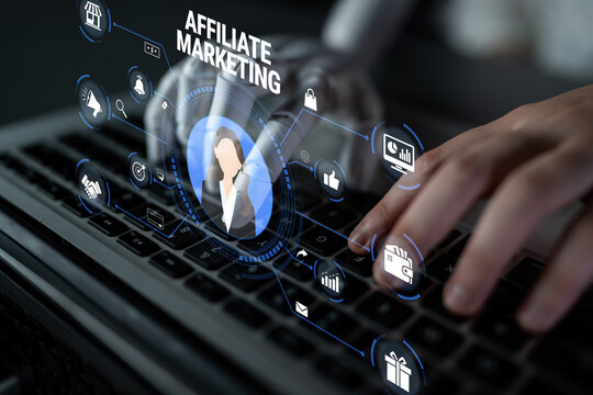 Hands of a Person Typing on a Laptop Keyboard with Affiliate Marketing Concept Visual Display and Digital Icons Representing Online Business Strategy Quark.