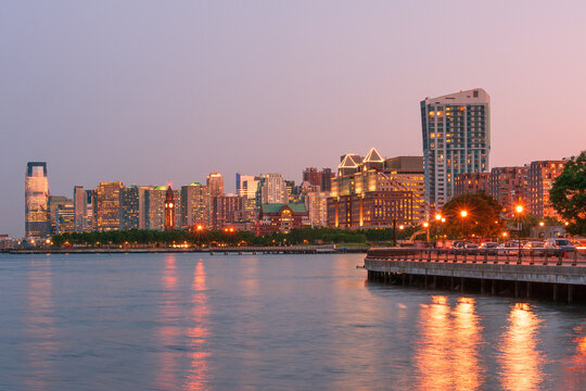 Jersey city skyline with modern condo highrises along Hudson river at twilight, New Jersey, USA
