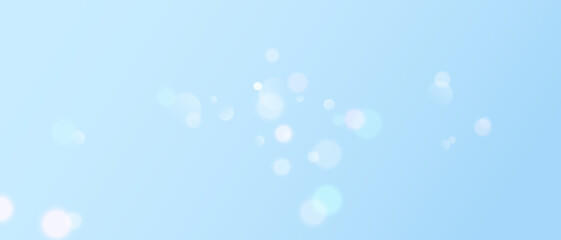 Abstract bokeh background in soft light blue tones. Subtle and calming design with floating light circles. Perfect for web backdrops and digital designs.