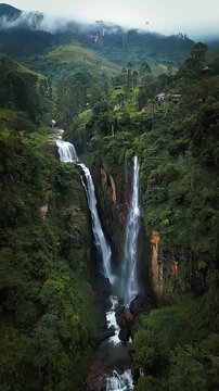 cinematic aerial view of ramboda falls waterfall and lush green hills sri lanka
