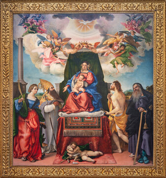 BERGAMO, ITALY - MARCH 18, 2026: The renaissance painting of Madonna with the St. Catherine, Augustine, Sebastian, Anthony the Abbot in the church Chiesa di Santo Spirito by Lorenzo Lotto (1521).
