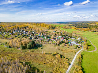 Obraz premium Drone photograph showing land category change from agricultural to residential and infrastructure use for rural settlement expansion in Kuzbass, selective focus